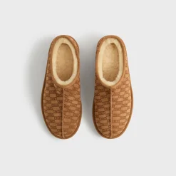 Chaussons en peau lainée monogrammée Kith