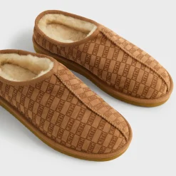 Chaussons en peau lainée monogrammée Kith